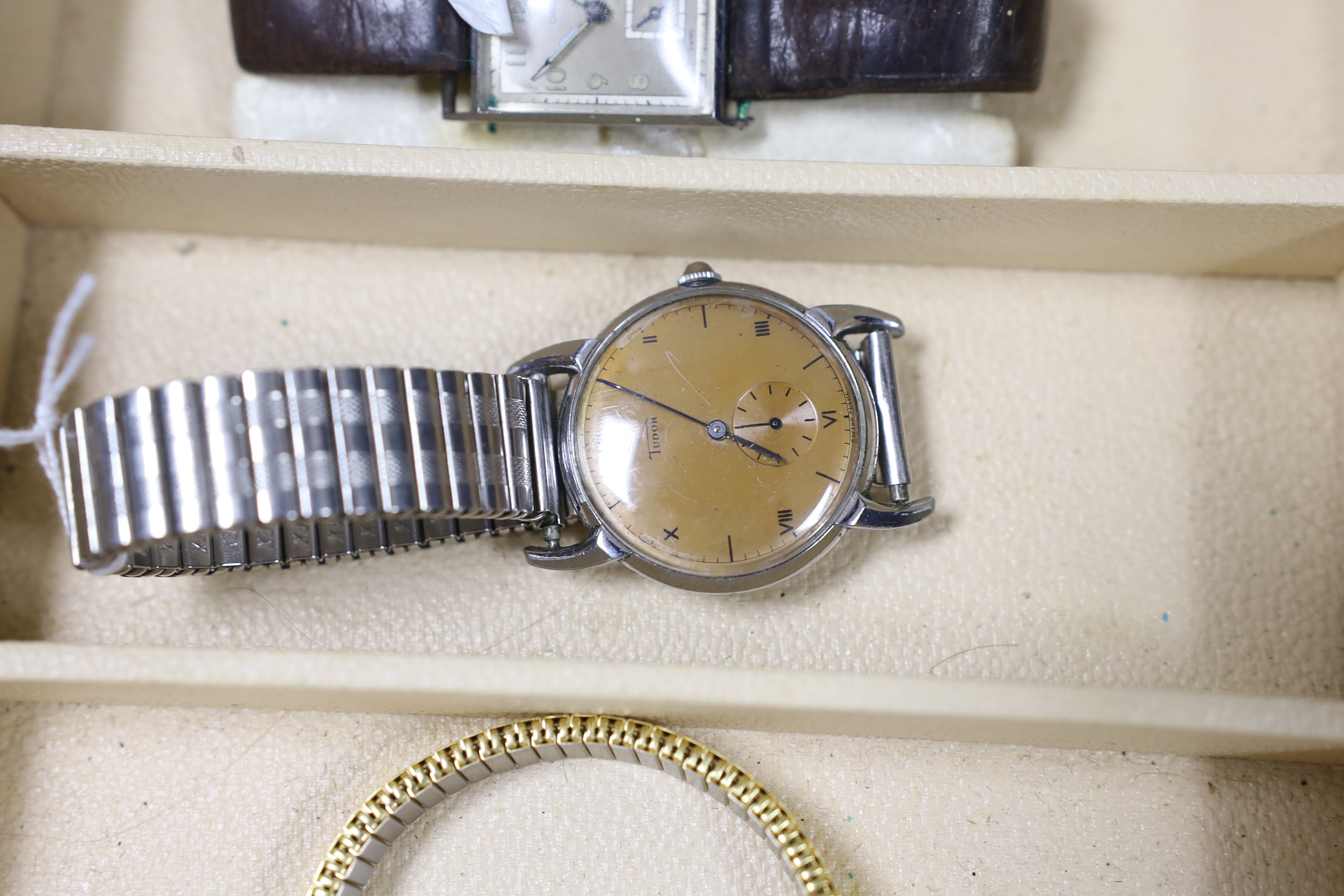 Seventeen assorted lady's or gentleman's wrist watches including a silver manual wind Omega, circa 1917 and a stainless steel Tudor, together with a pedometer?